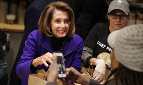 Nancy Pelosi helps distribute food to furloughed federal workers in Washington DC on 22 January. 