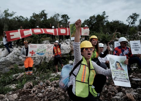 People protest the environmental impact of the Maya Train, in Playa del Carmen, Mexico