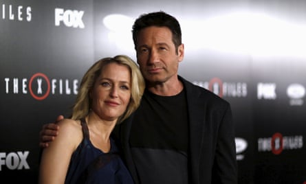 Cast members Gillian Anderson and David Duchovny pose at a premiere for The X-Files at California Science Center in Los Angeles.