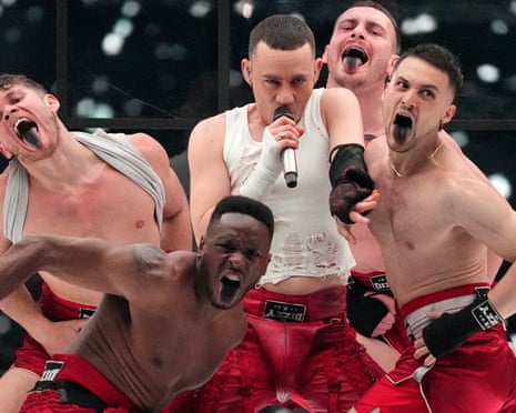 Olly Alexander and four dancers on stage during his performace.