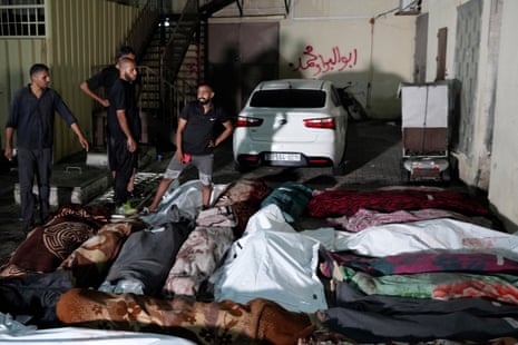 Bodies laid out before burial after an Israeli bombardment of the Unrwa school at Nusseirat refugee camp, 6 June.