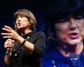 a woman speaks into a microphone