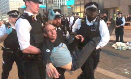 Screengrab from a video of Olympic gold medallist Etienne Stott being arrested by police at the Extinction Rebellion demonstration on Waterloo Bridge