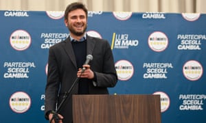 man with microphone at a lectern