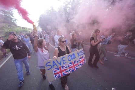 Protesters in Epping light flares