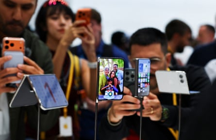 Apple holds event at the Steve Jobs Theater on its campus in CupertinoPeople look at the new foldable iPhone Duo devices on display during Apple’s event at the Steve Jobs Theater in Cupertino, California, U.S. September 9, 2026. REUTERS/Carlos Barria