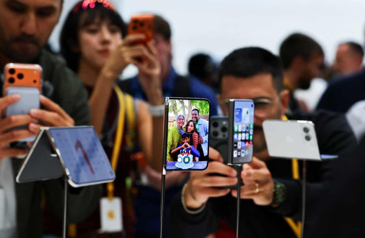 Apple holds event at the Steve Jobs Theater on its campus in CupertinoPeople look at the new foldable iPhone Duo devices on display during Apple’s event at the Steve Jobs Theater in Cupertino, California, U.S. September 9, 2026. REUTERS/Carlos Barria