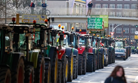 line of tractors in town