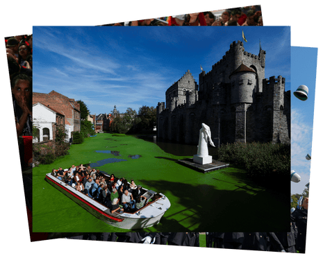A group of people look up at a castle from a boat on the River Lys, which is almost completely green from duckweed
