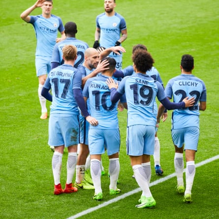 Sergo Agüero is congratulated by his team-mates after scoring for Manchester City.