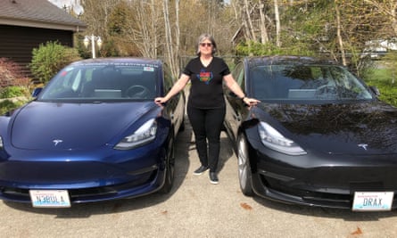 Theresa Ramsdell with her two Teslas.
