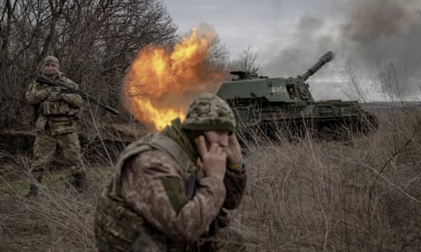 Ukrainian soldiers fires towards the Russian position near Avdiivka.