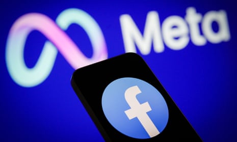The Meta logo is seen with a Facebook logo on a mobile device in photo illustration