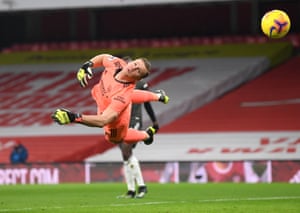 Arsenal goalkeeper Bernd Leno blocks a shot.
