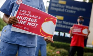 Registered nurses and members of National Nurses United demand better protection from coronavirus in Washington DC in July.