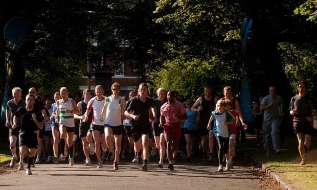 Runners take part in a 5km parkrun in Hyde park in Leeds.