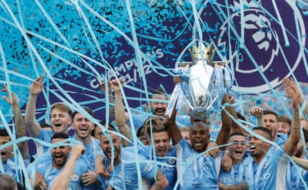 Manchester City captain Fernandinho lifts the Premier League trophy after their triumph in the 2021/22 season