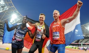 Alaize celebrates after winning bronze in the men’s long jump at the IPC World ParaAthletics Championships 2017, with gold medalist Markus Rehm of Germany and silver medalist Ronald Hertog of the Netherlands.