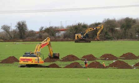 Diggers start work in fields in the village of Guston near Dover, Kent, where the Department of Transport has purchased the White Cliffs site with plans to turn it into an Inland Border Facility and lorry park for 1,200 trucks.