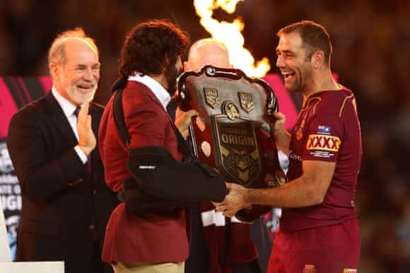 Johnathan Thurston and Cameron Smith of the Queensland Maroons hold aloft the Origin trophy.