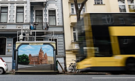 A bus passes an air quality monitoring station in Berlin.
