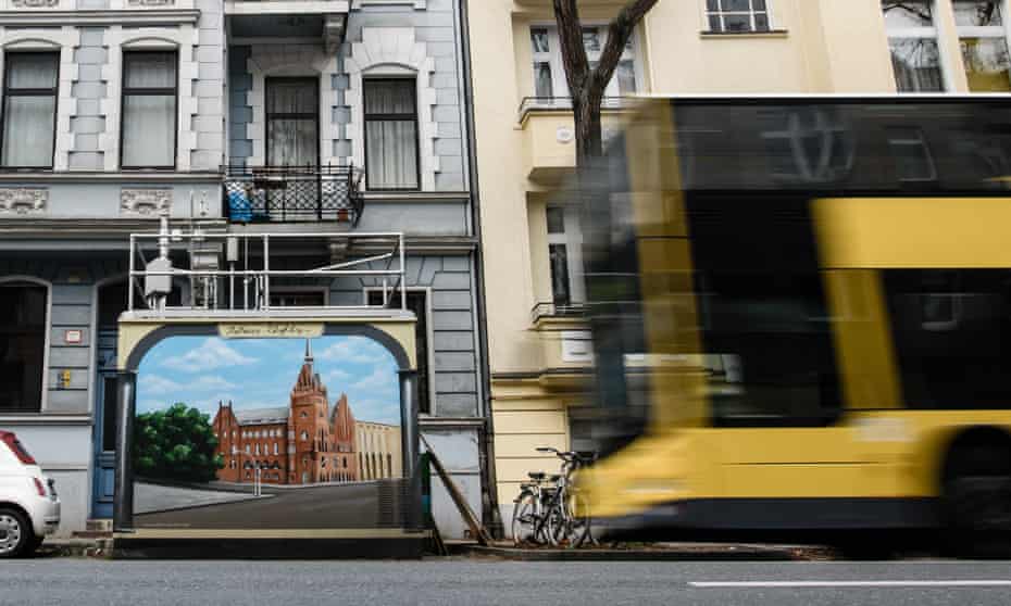 A bus passes an air quality monitoring station in Berlin.