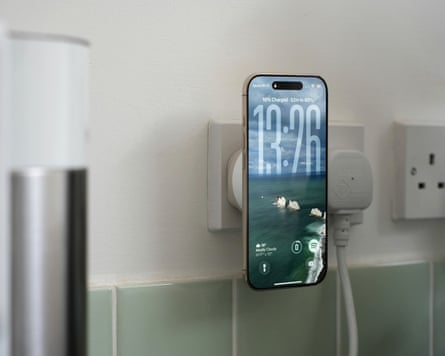 The Apple iPhone Air charging on a Twelve South PowerBug wireless charging plug.