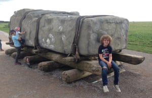 The writer’s son with a fibreglass copy of one of the stones at the visitor centre