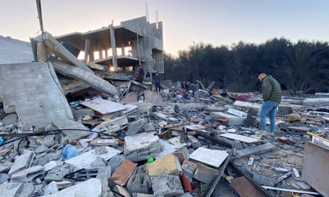 Palestinians inspect the ruins of a house in Khan Younis in the southern Gaza Strip.