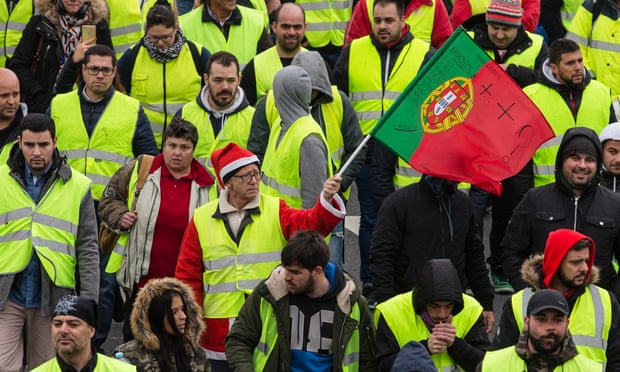 Yellow vests protesters gather in Porto, Portugal, on 21 December to demand an end of the tax on petroleum products and lower VAT on fuels, among other things. 