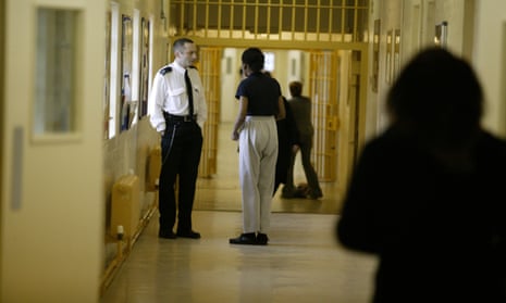 A prison officer chats to an inmate at Brockhill womens prison in Redditch Worcestershire UK