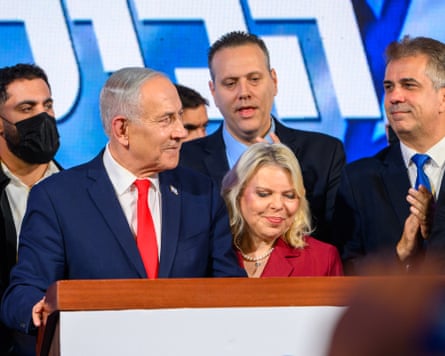 Benjamin Netanyahu on stage with his wife and allies