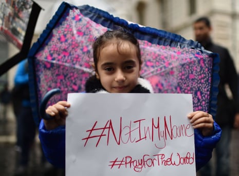 A little girl in Rome holds a placard during a demonstration by Muslims against terrorism a week after Paris attacks.