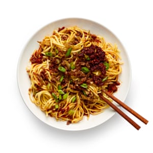 Top with the crunchy stir-fry and spring onions, and the dan dan are done