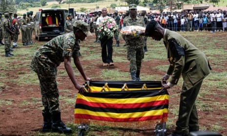 Members of the Uganda People's Defence Force carry the casket of Olympic athlete Rebecca Cheptegei