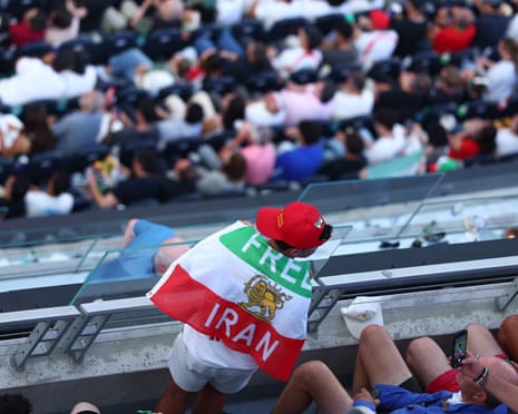 In this picture obtained from Iran's ISNA news agency on April 24, 2026, Iranians
issue on Monday. ![A pre-Iranian Revolution flag displayed in the stands