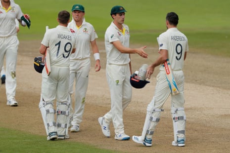 James Anderson shakes hands with Pat Cummins who took four wickets today.