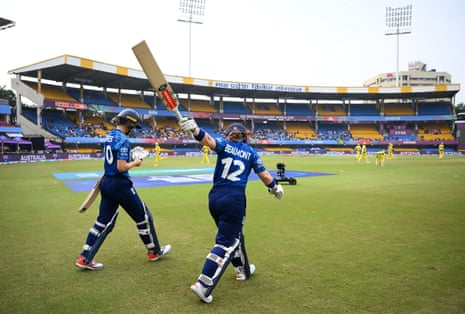 England’s Tammy Beaumont and Amy Joneswalk out to bat against Australia.