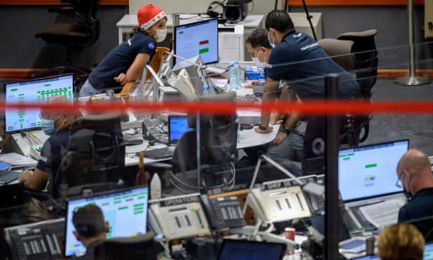 Teams monitor the countdown to the launch of the Ariane 5 rocket.