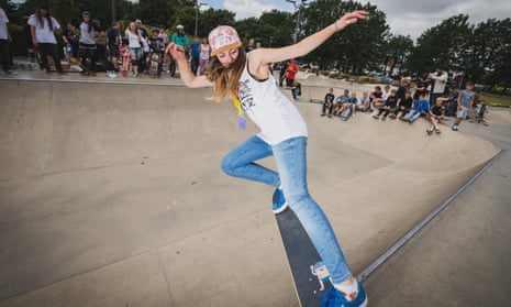 A teenage girl skating at The Level Skatepark in Brighton, East Sussex, England.