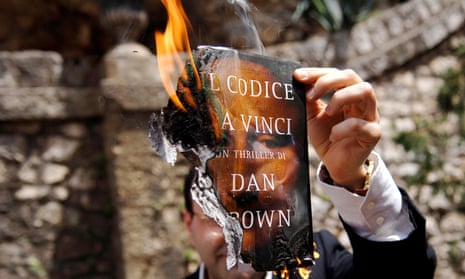 Flaming terrible: Stefano Gizzi, Christian Democrat party’s city councillor in Ceccano, sets The Da Vinci Code on fire. 