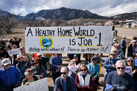 people hold a sign that reads 'a healthy home world is job #1 nothing works without it there is no planet b'
