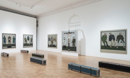 Paintings on display in a white-walled room