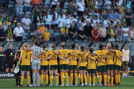 The Matildas line up for the national anthem.