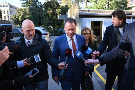 Colin Brooks (middle) arrives at Victoria’s parliament.
