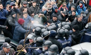 Police officers use teargas against supporters of Saakashvili.