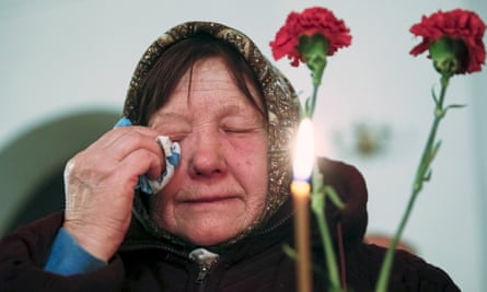 A woman cries during a memorial service for victims of the Chernobyl nuclear disaster in a church in Kiev.