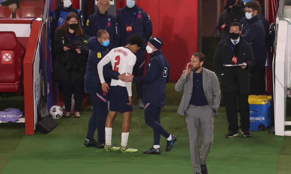 Trent Alexander-Arnold is helped off the pitch after picking up a late injury