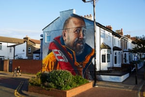 New Brighton, England. A newly unveiled mural of Mike Jones, an RNLI volunteer who has worked for 40 years at the nearby lifeboat station