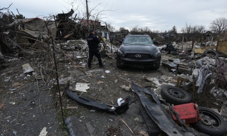 A police officer inspects a residential area damaged during a Russian missile strike in Kamianske, Dnipropetrovsk region, Ukraine.